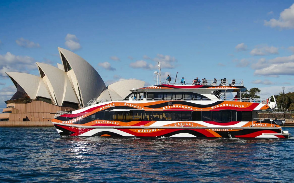 Comedy cruise boat near Sydney Opera House during Sydney Comedy Festival.