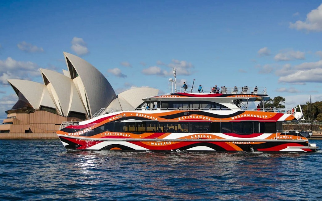 Comedy cruise boat near Sydney Opera House during Sydney Comedy Festival.