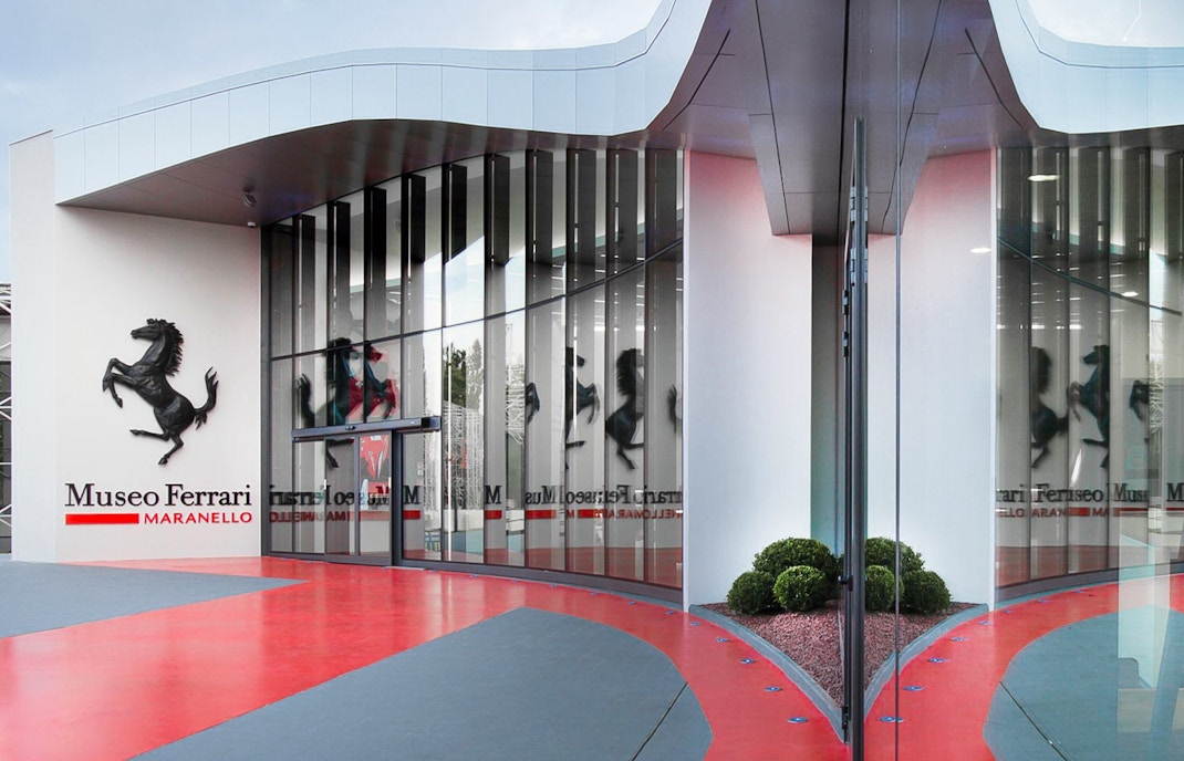 Ferrari Museum Maranello entrance with iconic prancing horse logo.