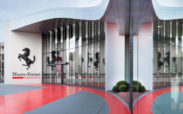 Ferrari Museum Maranello entrance with iconic prancing horse logo.