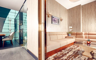 Plaza Premium Lounge seating area with modern decor at Dubai International Airport.
