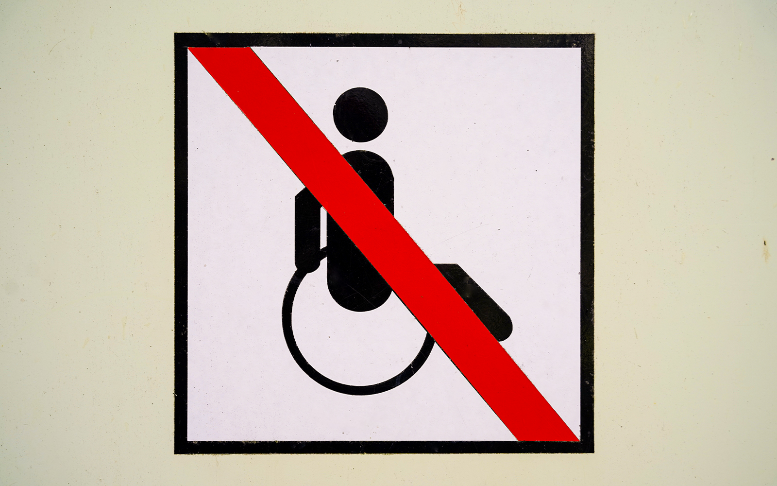 No wheelchair access symbol with red diagonal line.