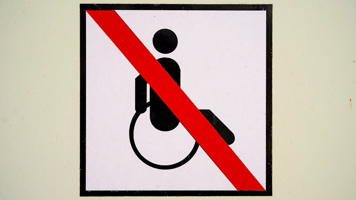 No wheelchair access symbol with red diagonal line.