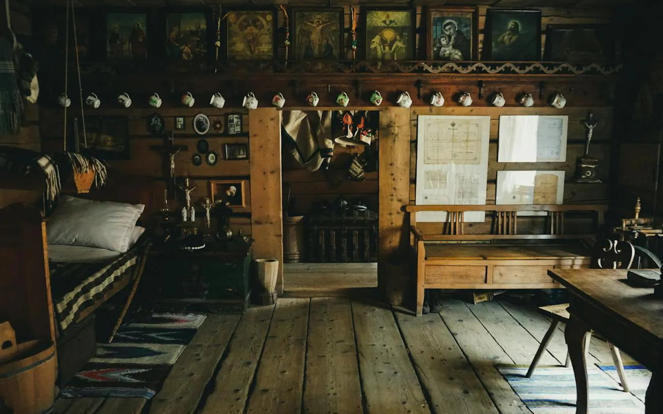 Traditional wooden interior in Zakopane with rustic decor and religious icons.