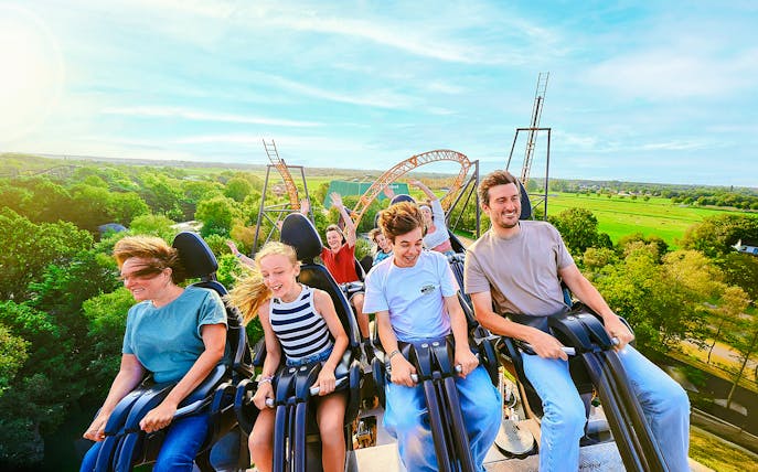 Guests enjoying a rollercoaster ride at Bobbejaanland theme park.