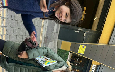 Participants engaging in Brighton Secret Society Mystery game on city street.