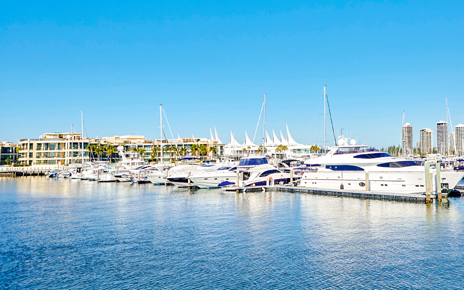 Marina Mirage view with yachts docked, Gold Coast buffet lunch setting.