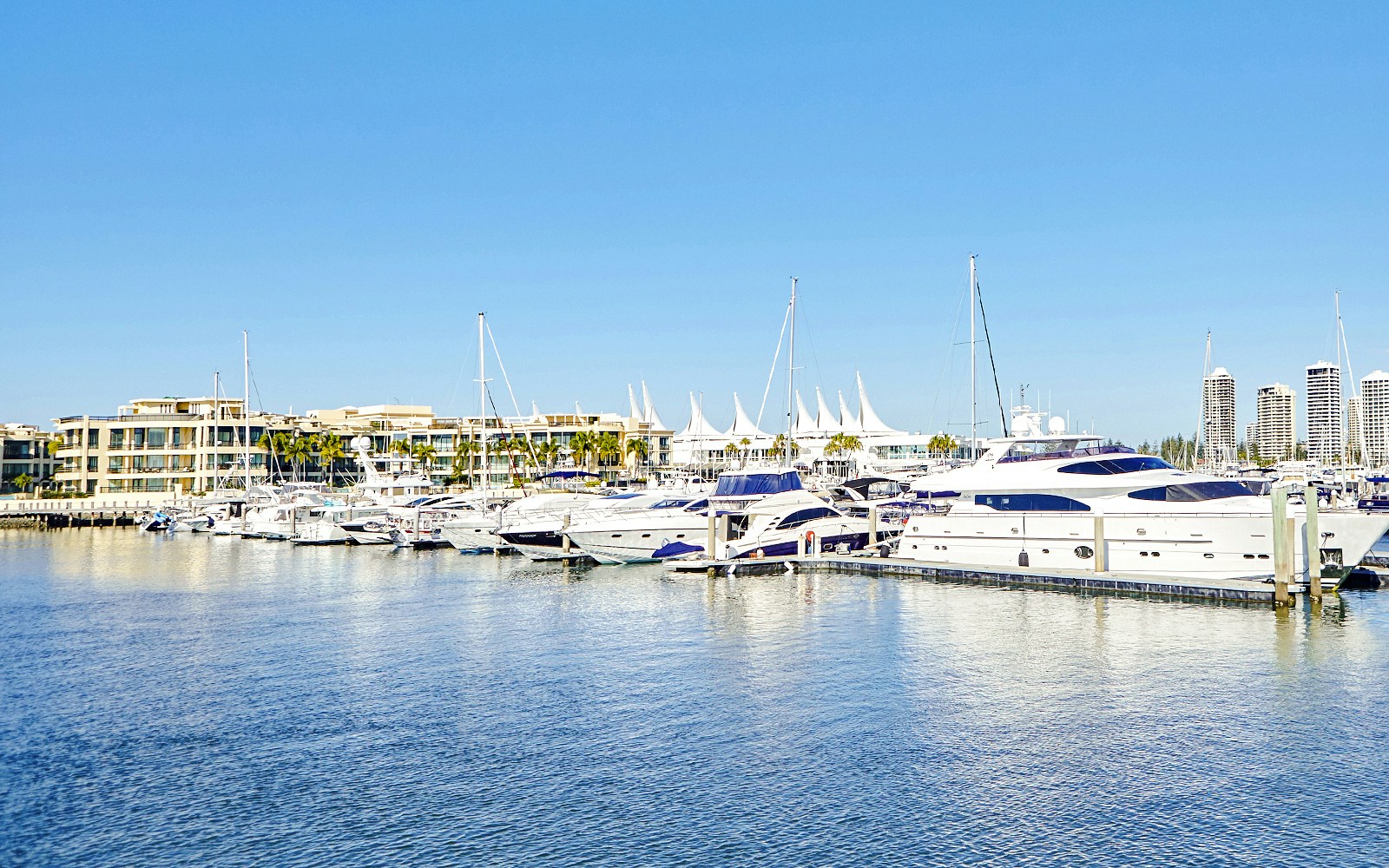 Marina Mirage view with yachts docked, Gold Coast buffet lunch setting.