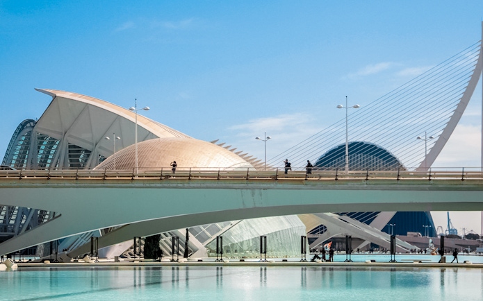 Tourist on bridge at Hemisfèric, City of Arts and Sciences, Valencia.