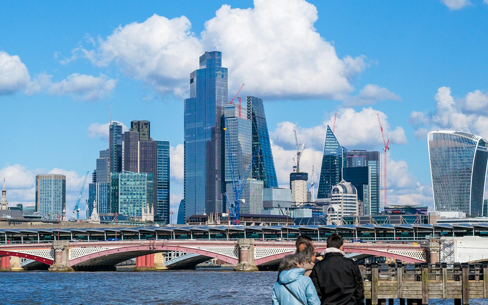 Skyline view of London with Blackfriars Bridge and modern skyscrapers.