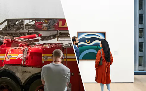 Fire truck display and visitors viewing art in a museum.