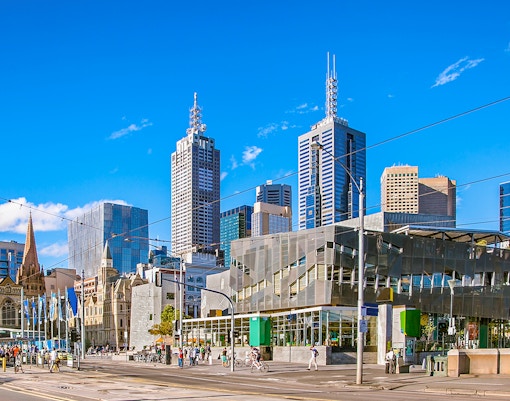 Federation Square with Melbourne skyline in the background, Australia.