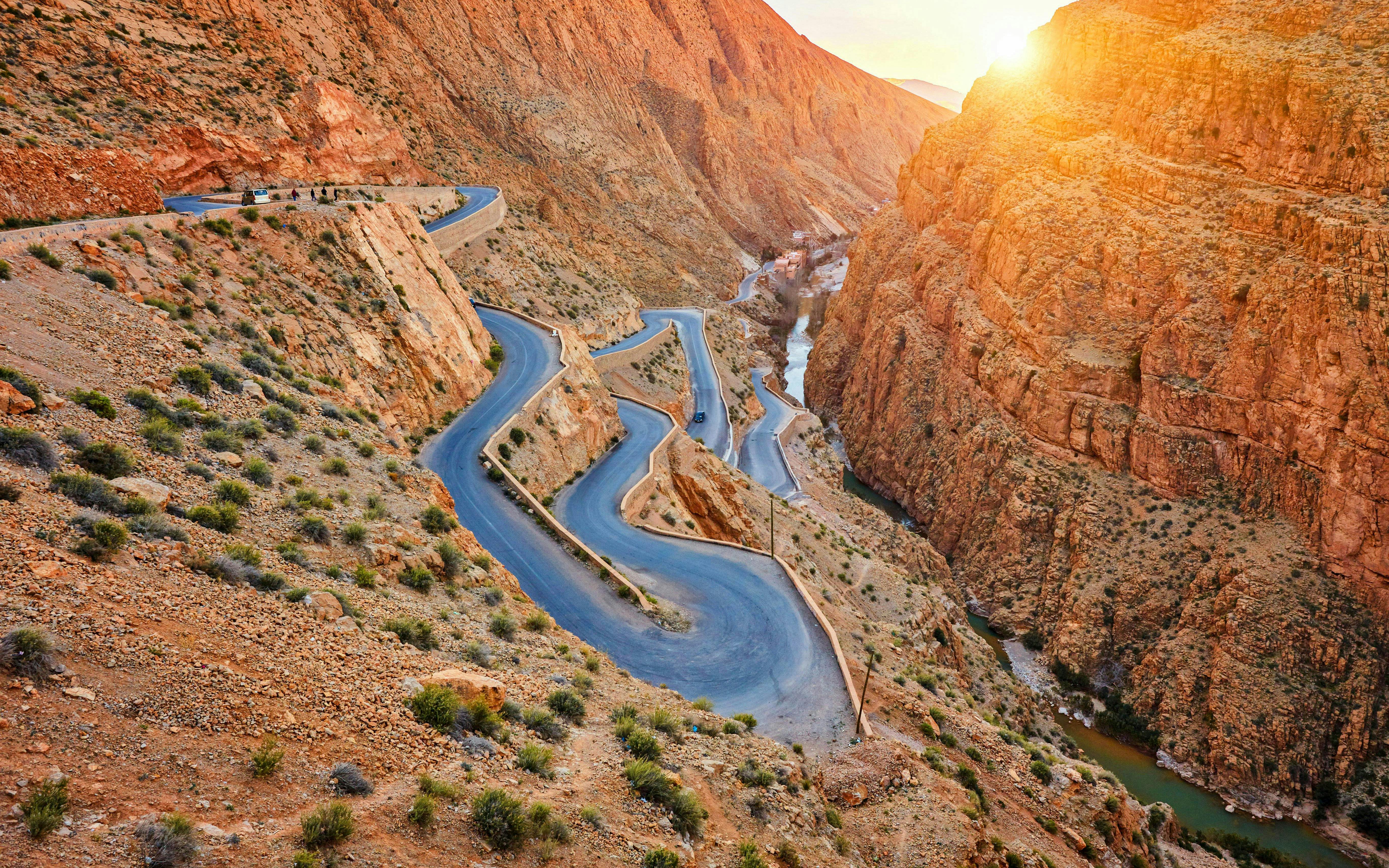 Winding road through Dades Gorge in Atlas Mountains, Morocco at sunset.