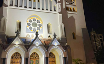 Historic church facade illuminated at night, Dar es Salaam Old Town Walking & Food Tour, Zanzibar.