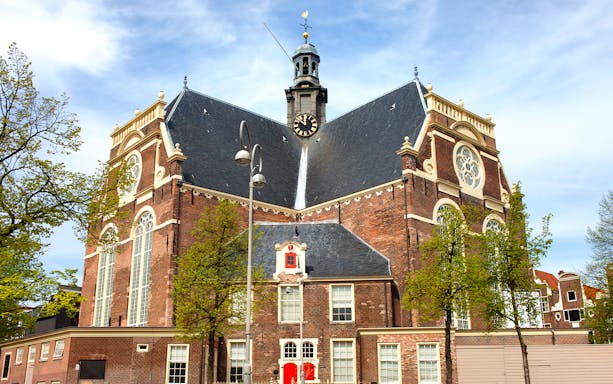 Noorderkerk exterior with clock tower and trees, Amsterdam.
