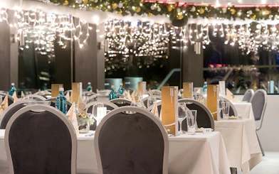 Dining setup on a decorated cruise ship for an afternoon advent cruise in Düsseldorf.