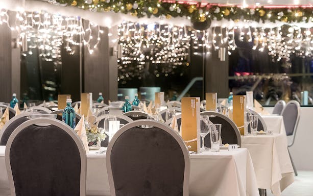 Dining setup on a decorated cruise ship for an afternoon advent cruise in Düsseldorf.