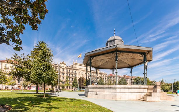 Santander city square with a gazebo and historic buildings in the background.