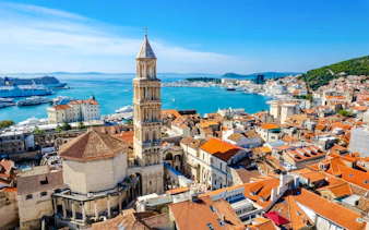 Diocletian's Palace and Split harbor view, Croatia, with historic architecture and cruise ships.