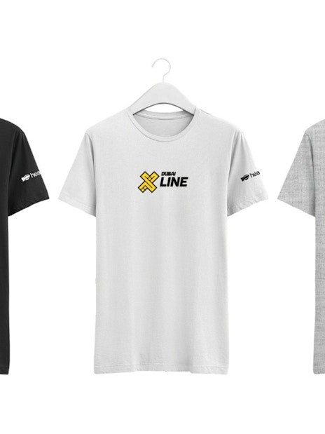 T-shirts with XLine Dubai Marina logo on hangers.