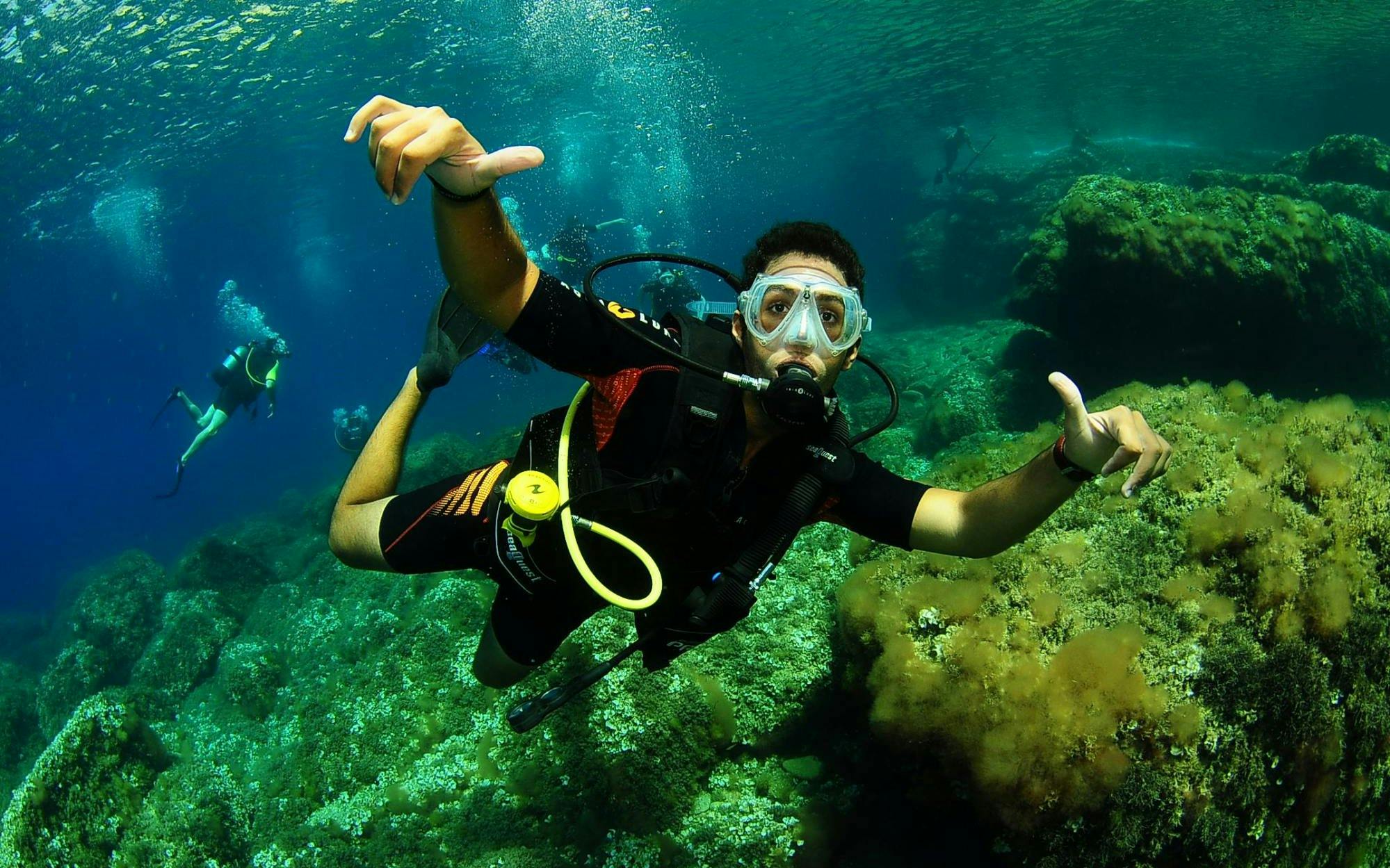 Scuba diver exploring underwater landscape in Ibiza.