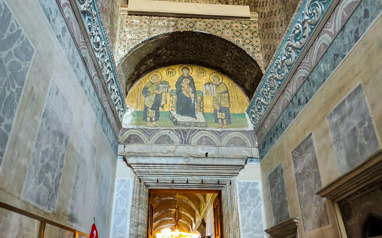 Hagia Sophia entrance door with mosaic above leading to prayer hall.