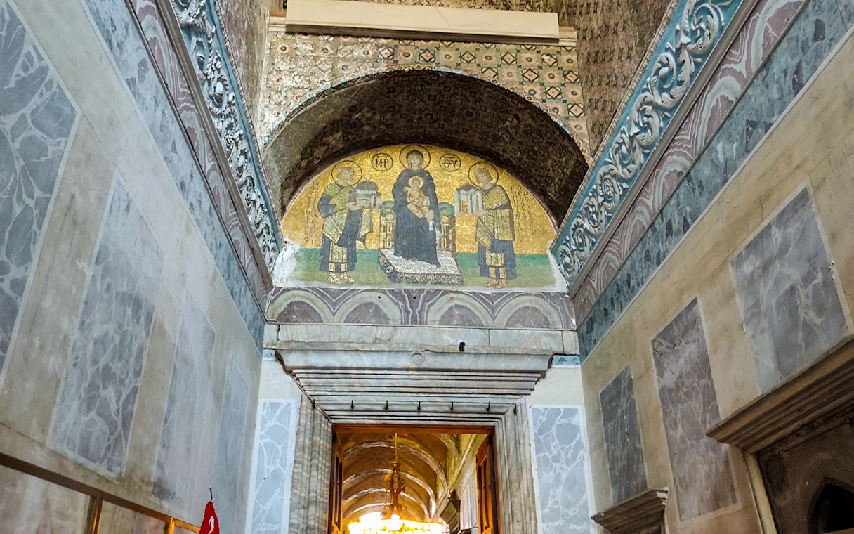 Hagia Sophia entrance door with mosaic above leading to prayer hall.