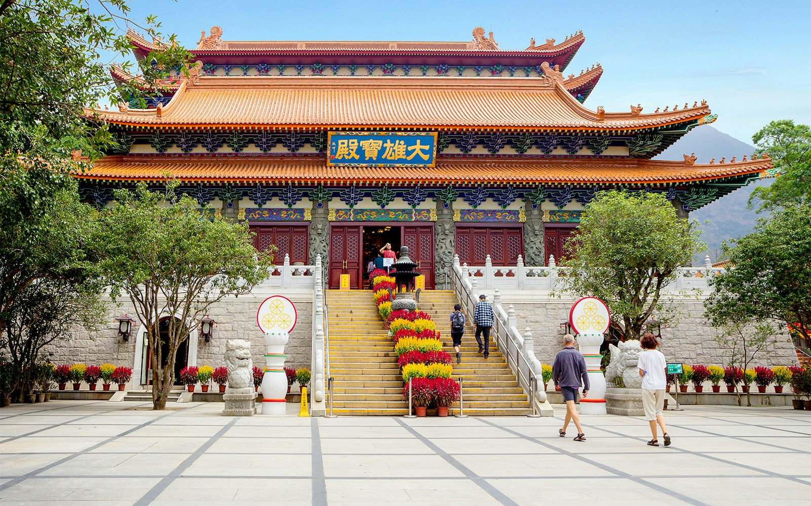 Po Lin Monastery entrance with visitors, Ngong Ping 360 Cable Car tour.