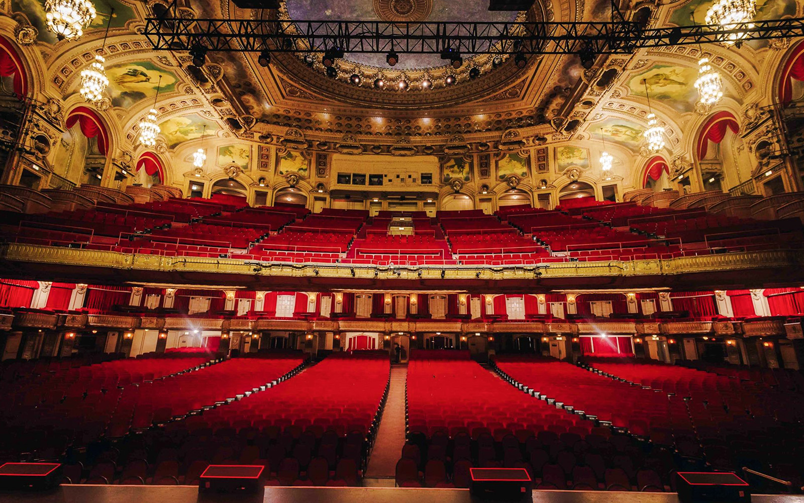 Interior view of The Chicago Theatre with ornate ceiling and red seating.