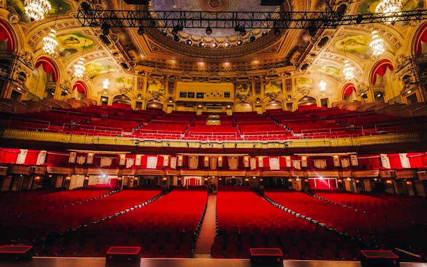 Interior view of The Chicago Theatre with ornate ceiling and red seating.