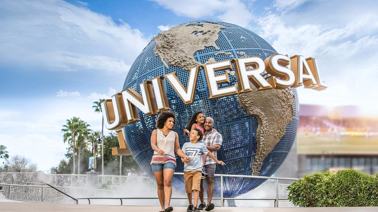 Family walking in front of the Universal Globe at Universal Studios Resort, Orlando.