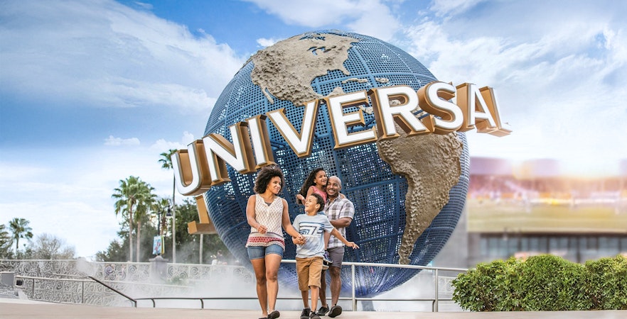 Family walking in front of the Universal Globe at Universal Studios Resort, Orlando.
