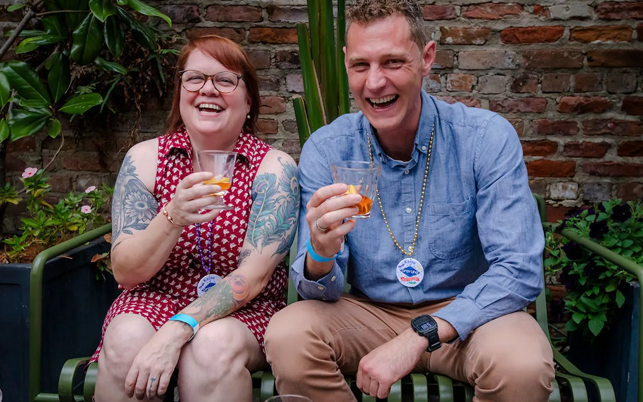 Couple enjoying drinks on New Orleans Craft Cocktail Walking Tour.