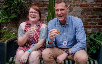 Couple enjoying drinks on New Orleans Craft Cocktail Walking Tour.