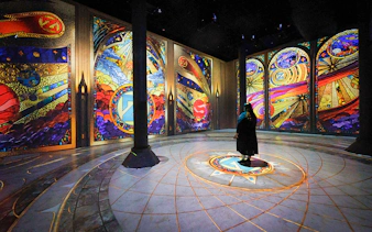 Guests viewing digital art projections at ARTECHOUSE New York exhibit.