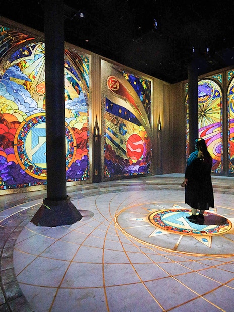 Guests viewing digital art projections at ARTECHOUSE New York exhibit.