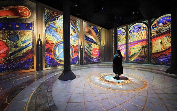 Guests viewing digital art projections at ARTECHOUSE New York exhibit.