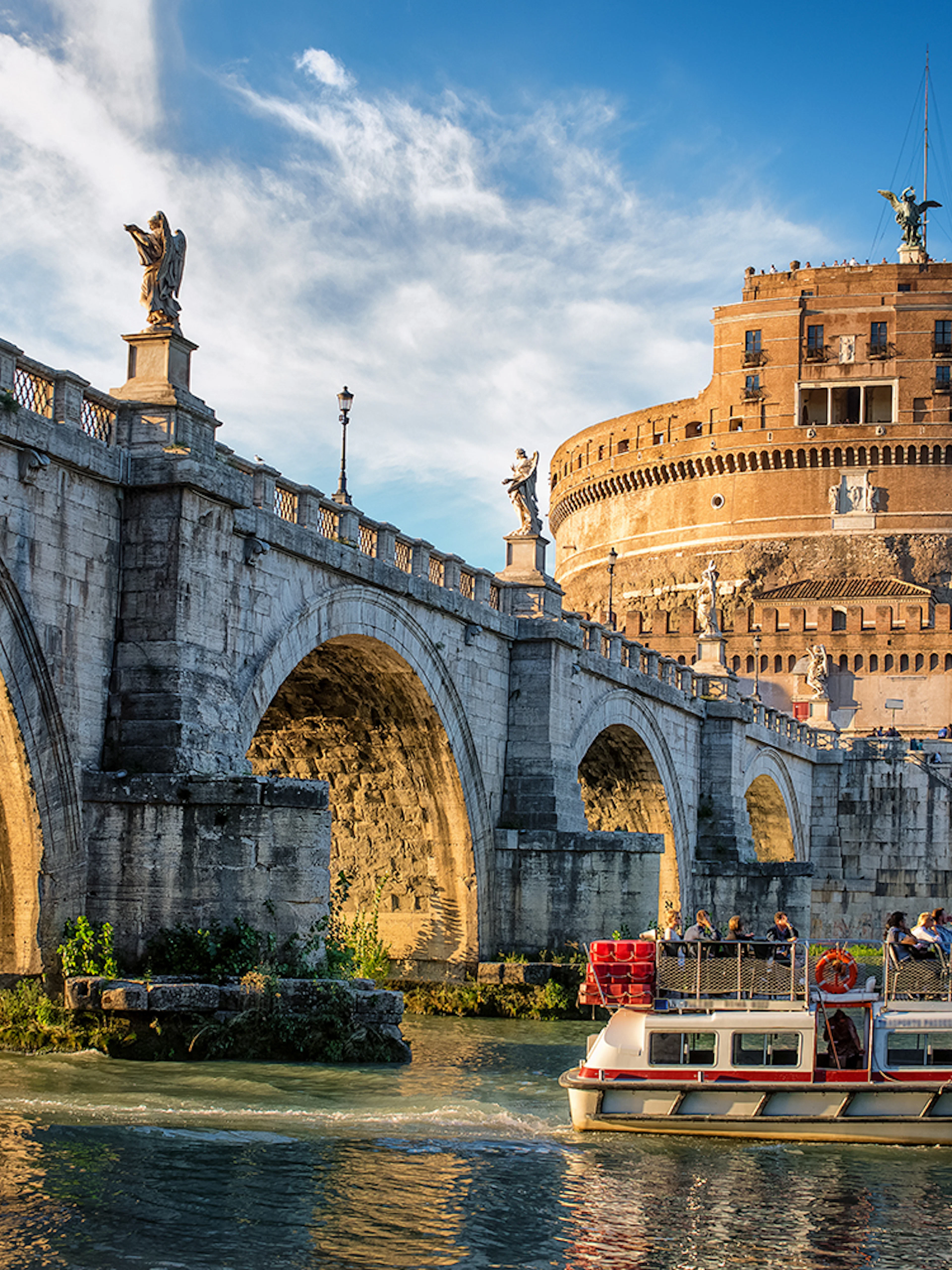 Cruise boat on the Tiber River near Castel Sant'Angelo, Rome.
