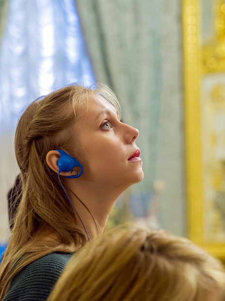 Visitor with audio guide at Gulbenkian Museum, Lisbon.