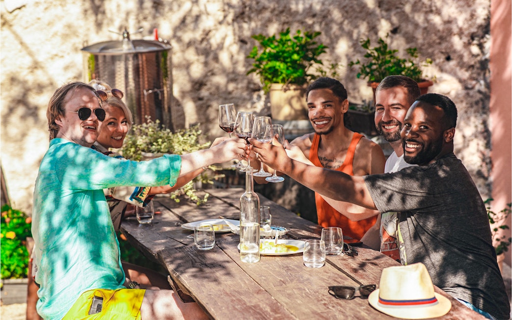 Group enjoying wine tasting at Krka National Park tour.