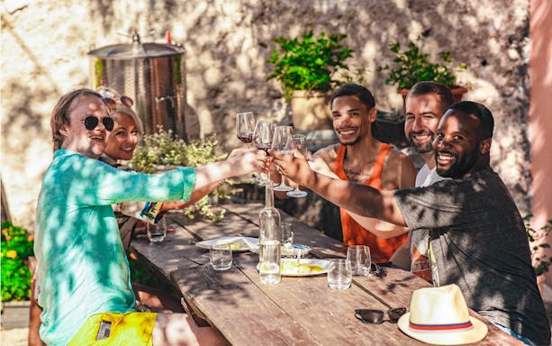 Group enjoying wine tasting at Krka National Park tour.