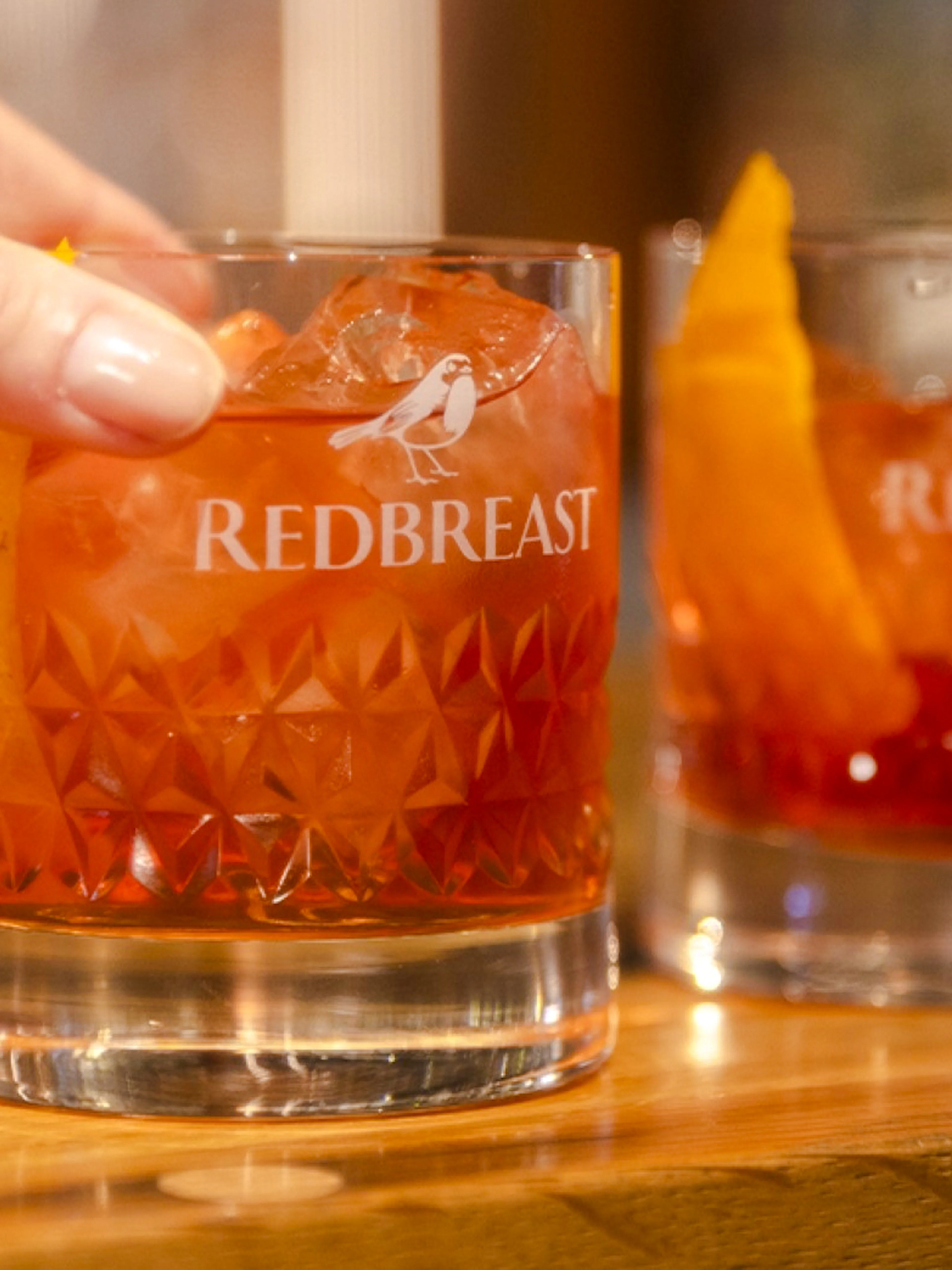 Redbreast whiskey glass with ice and orange peel at Jameson Distillery Midleton, Cork.