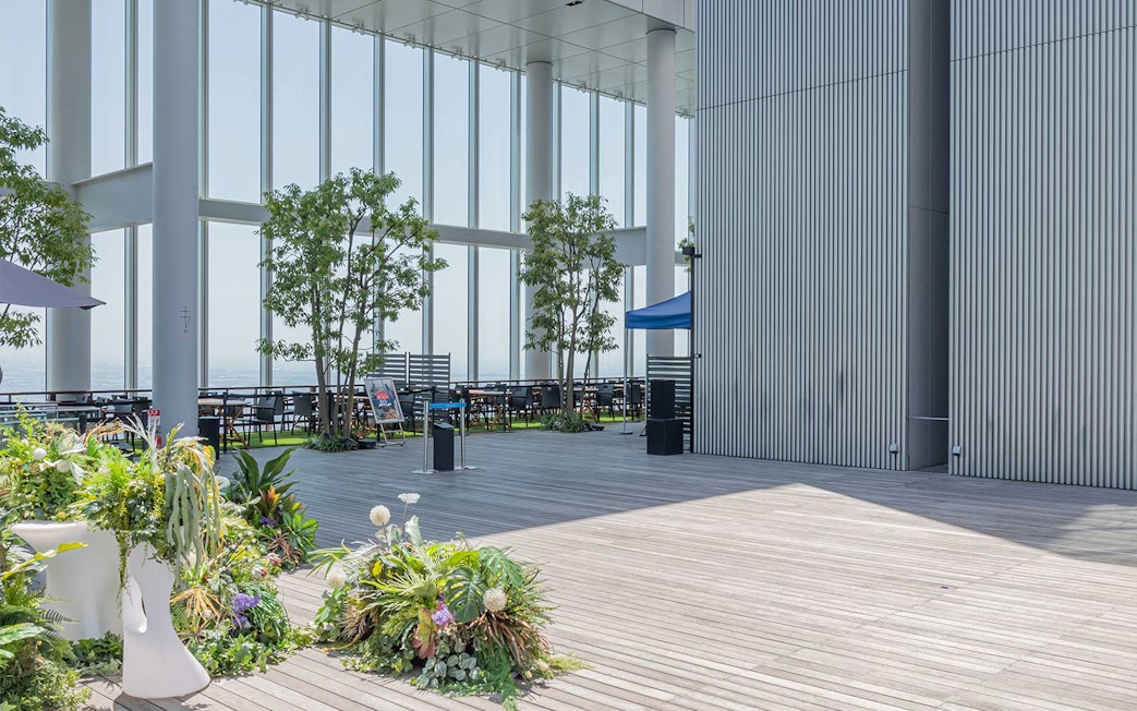 Harukas 300 Observatory deck with seating and greenery, Osaka, Japan.