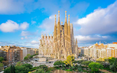 Sagrada Familia Cathedral in Barcelona with surrounding cityscape.