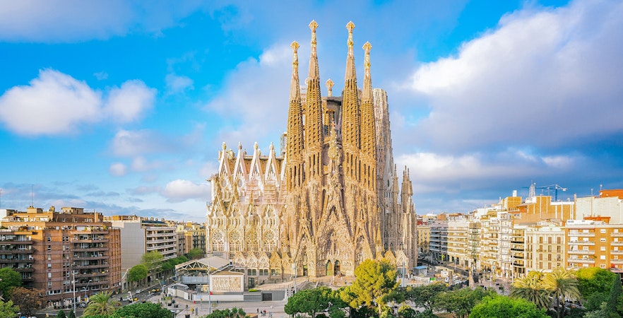 Sagrada Familia Cathedral in Barcelona with surrounding cityscape.