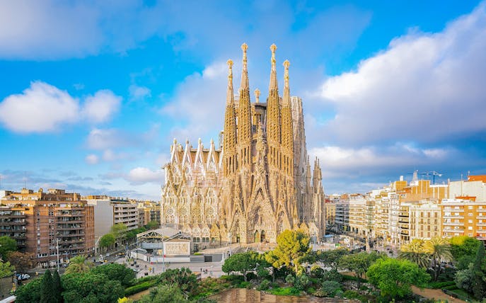 Sagrada Familia Cathedral in Barcelona with surrounding cityscape.