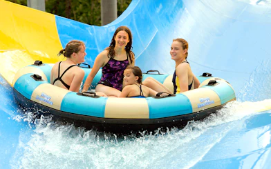Group enjoying Zoom Flume water ride at Six Flags King's Dominion.