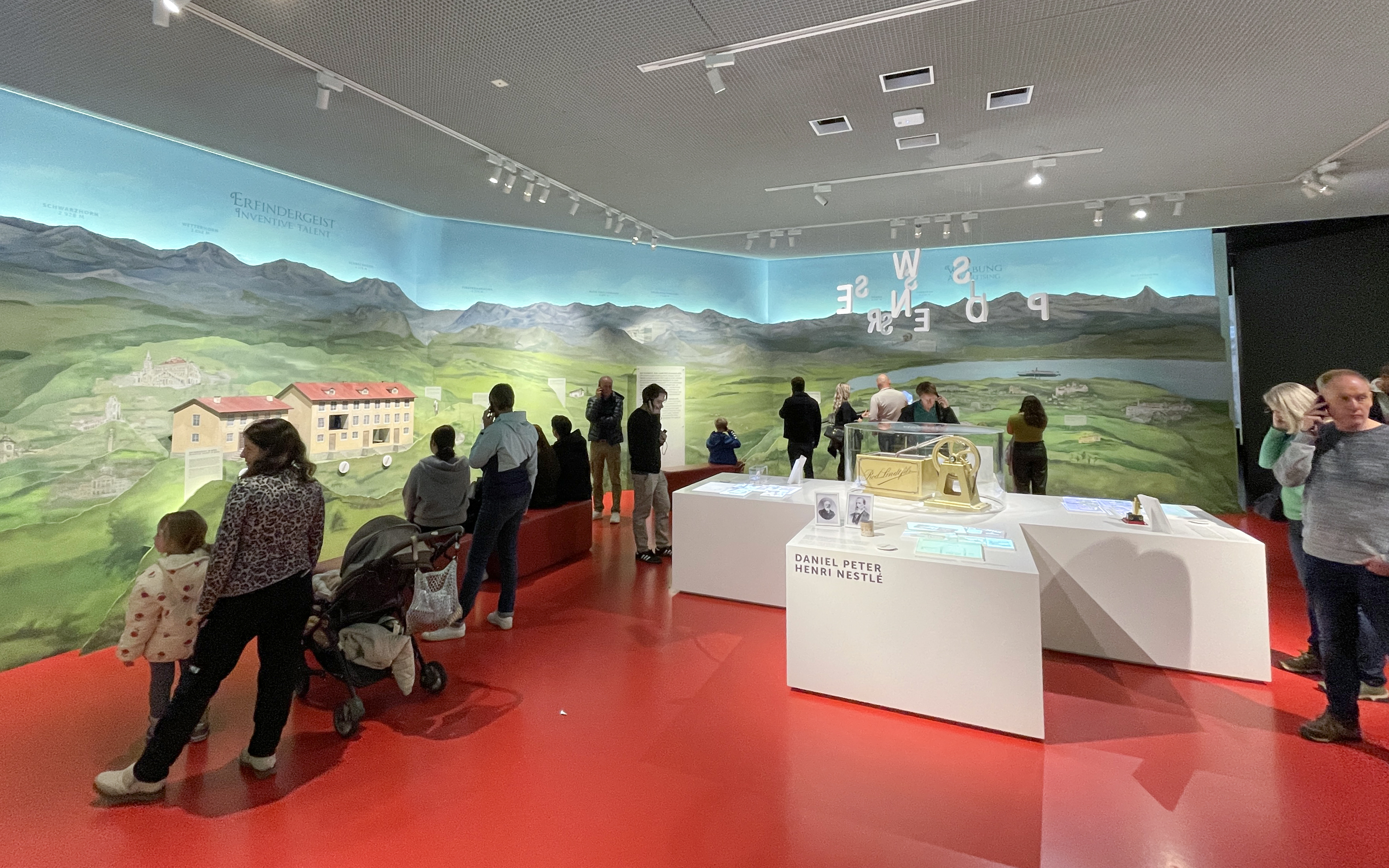 Visitors exploring exhibits at Lindt Home of Chocolate Museum, Zurich.