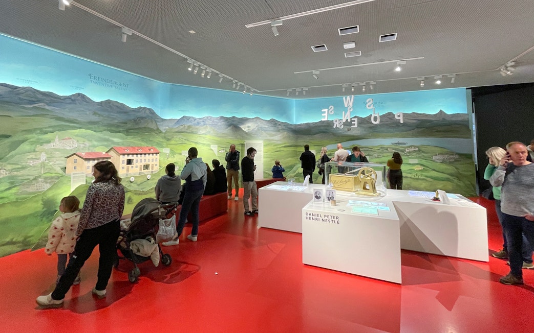 Visitors exploring exhibits at Lindt Home of Chocolate Museum, Zurich.