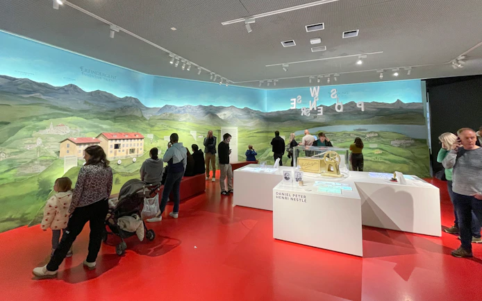 Visitors exploring exhibits at Lindt Home of Chocolate Museum, Zurich.
